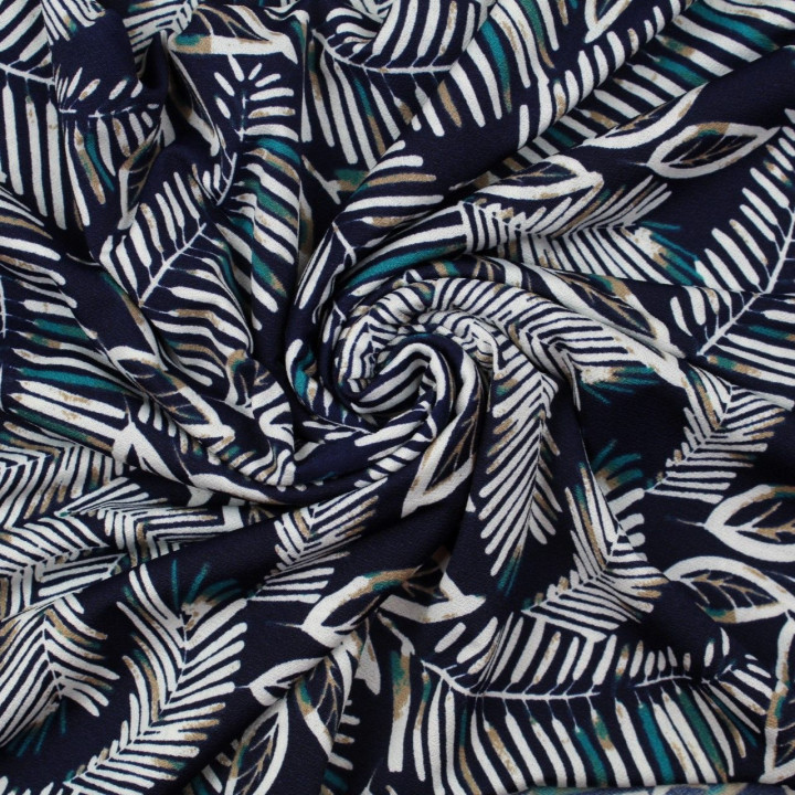 Tissu jersey polyester bleu marine imprimé feuillages