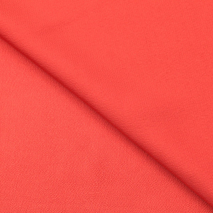 Tissus crêpe satin uni corail