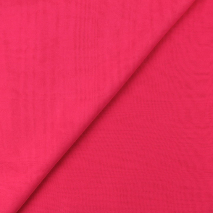 Tissu mousseline uni de couleur fuchsia fluo