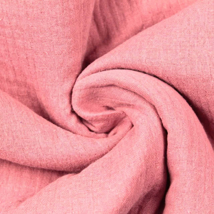 Tissu coton double gaze uni de couleur rose poudrée