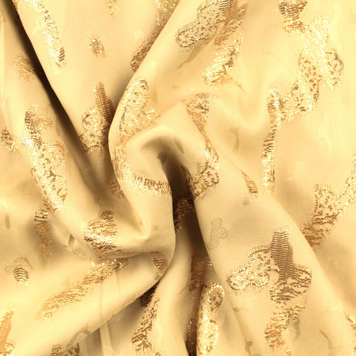 Tissu Tlija beige à motifs géométriques dorés élégants.