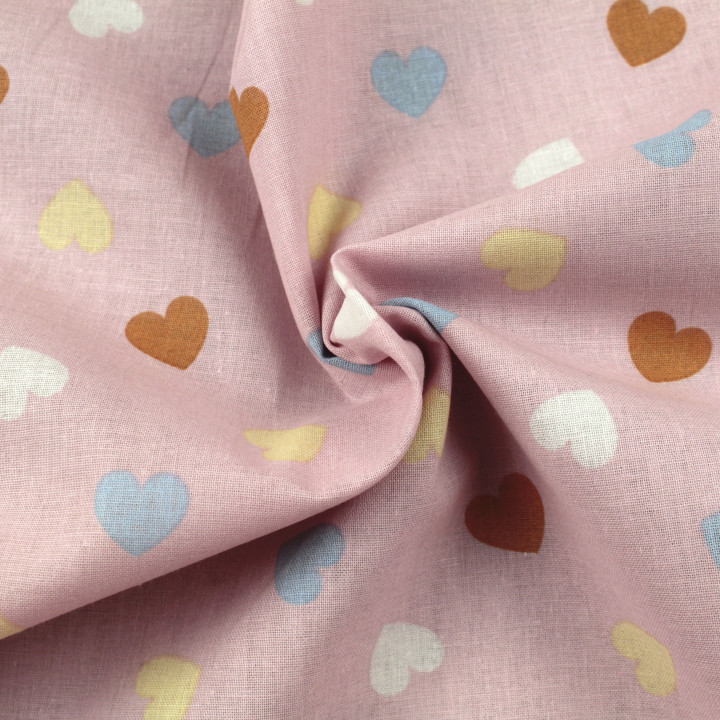 Tissu coton rose imprimé cœurs - Idéal pour habillement et couture au mètre