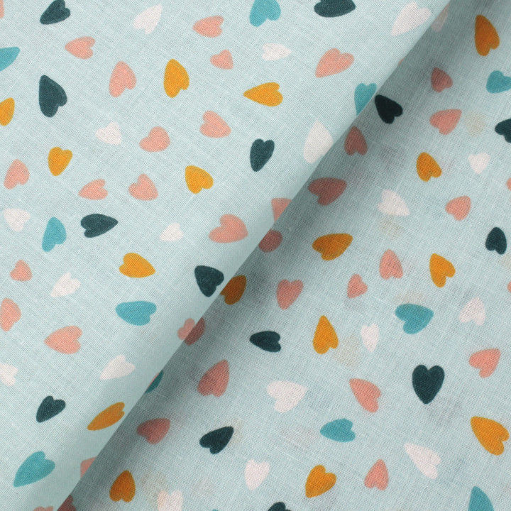 Tissu coton bleu claire imprimé cœurs - Idéal pour habillement et couture au mètre