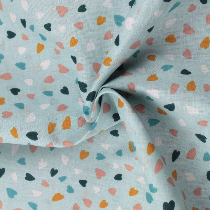 Tissu coton bleu claire imprimé cœurs - Idéal pour habillement et couture au mètre
