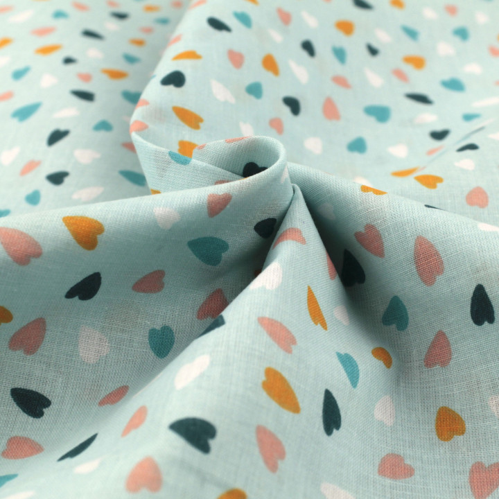 Tissu coton bleu claire imprimé cœurs - Idéal pour habillement et couture au mètre
