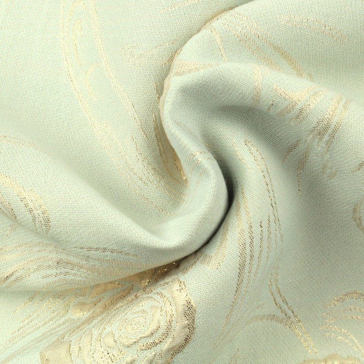 Tissu brocart vert amande à motif floral brillant