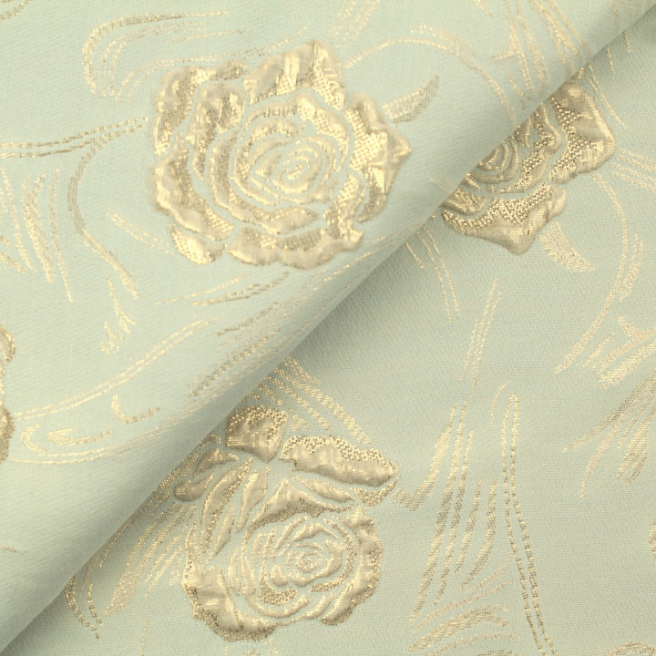 Tissu brocart vert amande à motif floral brillant
