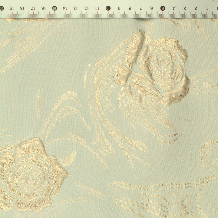 Tissu brocart vert amande à motif floral brillant