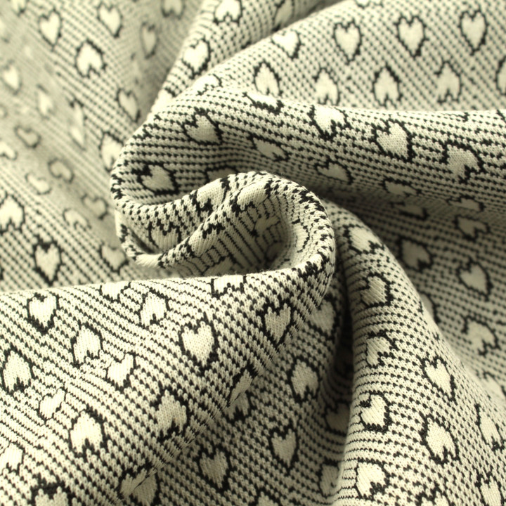 Tissu jersey blanc imprimé cœur géométrique