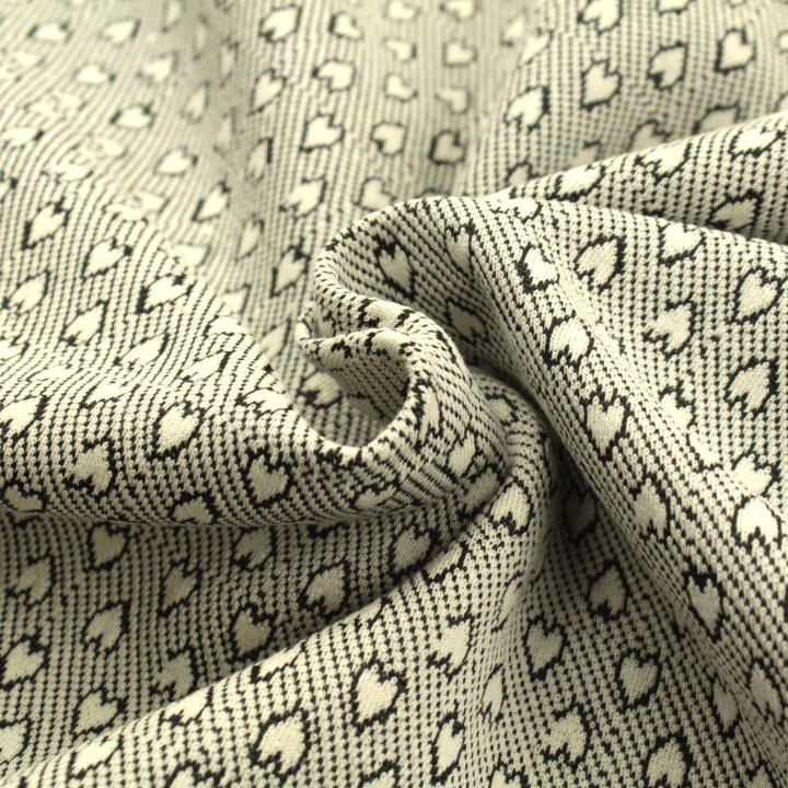 Tissu jersey blanc imprimé cœur géométrique