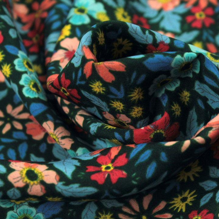Tissu polyester vert foncé à imprimé floral multicolore