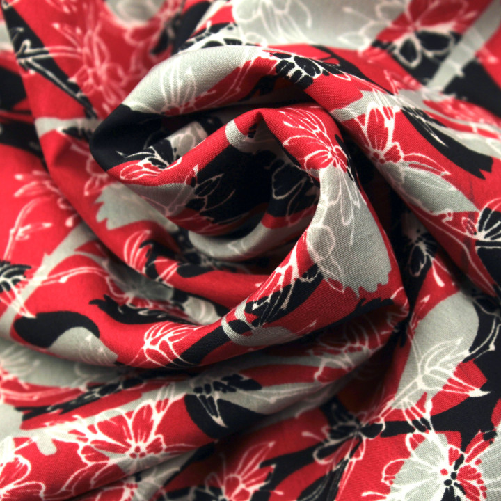 Tissu polyester rouge à imprimé floral gris et noir géométrique