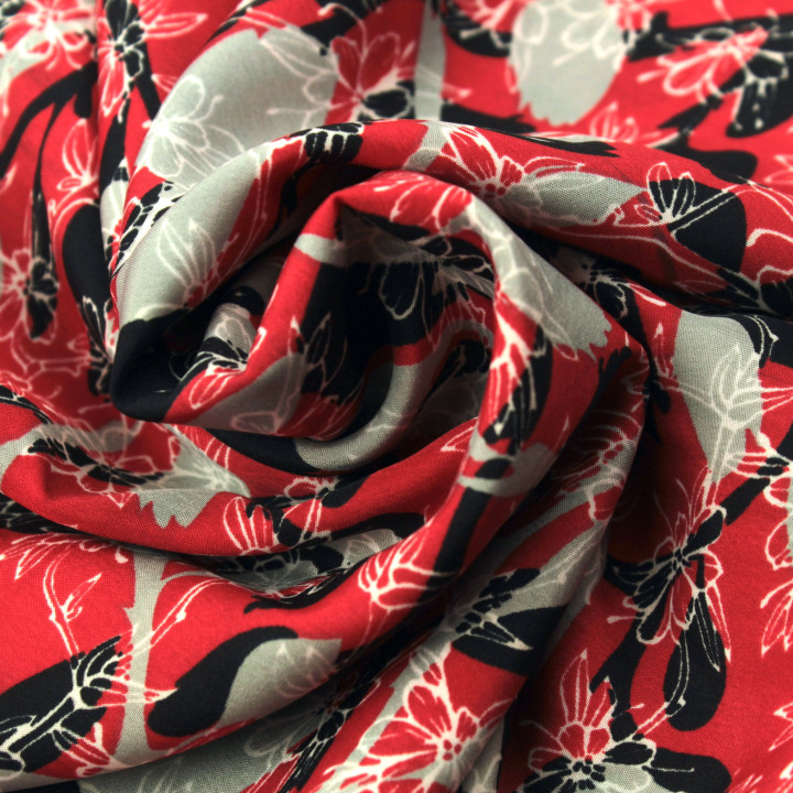 Tissu polyester rouge à imprimé floral gris et noir géométrique