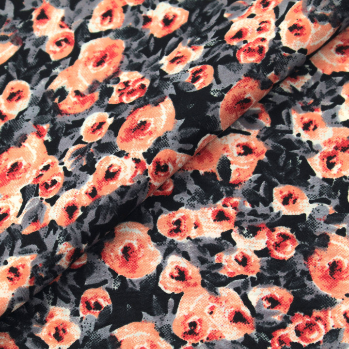 Tissu polyester noir à imprimé floral gris et orange