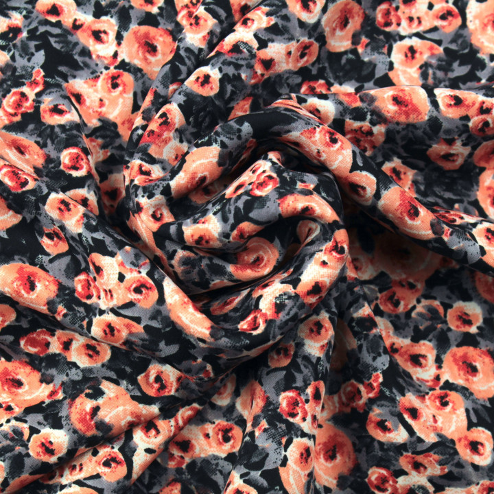 Tissu polyester noir à imprimé floral gris et orange