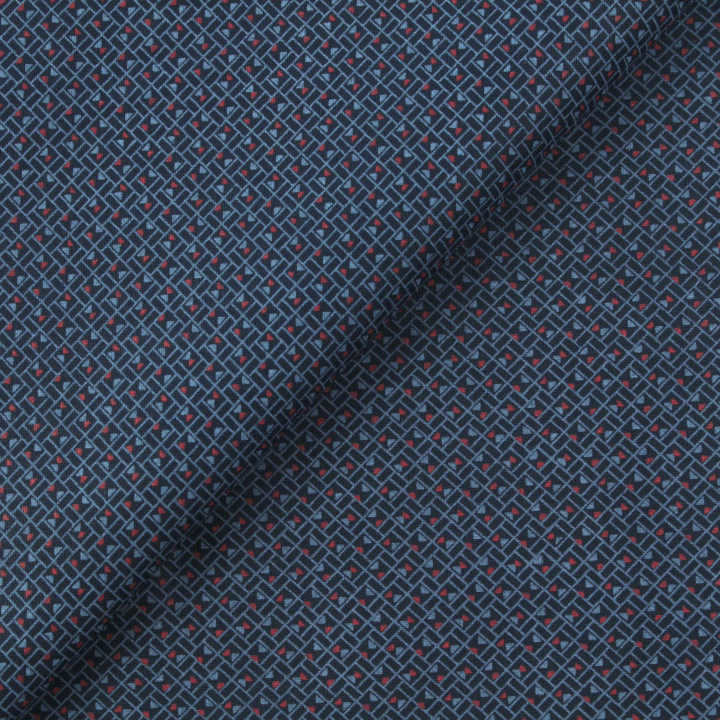 Tissu en coton bleu nuit à motif géométrique de petits triangles rouges et bleus