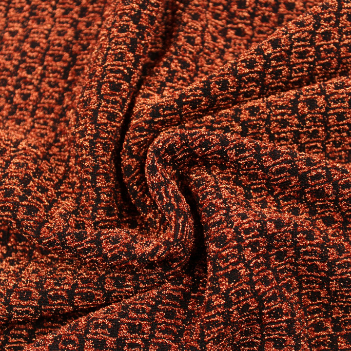 Tissu jersey tramé noir et orange brillant et extensible