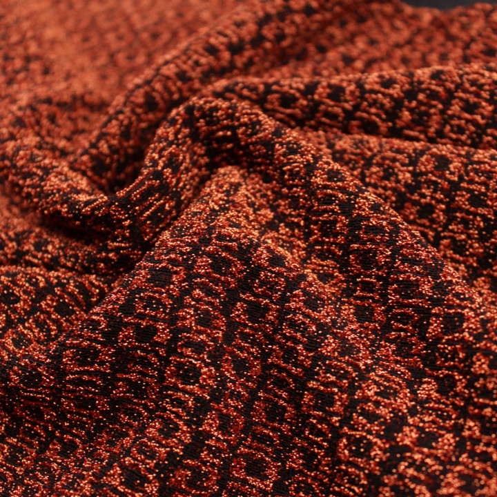 Tissu jersey tramé noir et orange brillant et extensible