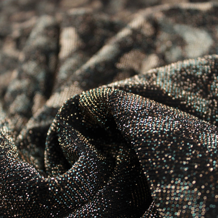 Tissu jersey noir motifs géométriques bronze et argent brillant et extensible