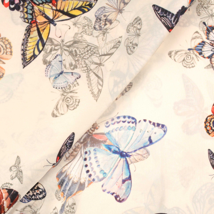 Tissu crème imprimé papillons rouge, bleu et jaune – Coupon haute qualité