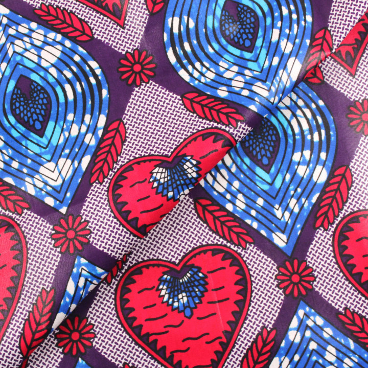 Tissu coton Wax imprimé géométrique rouge, bleu et rose