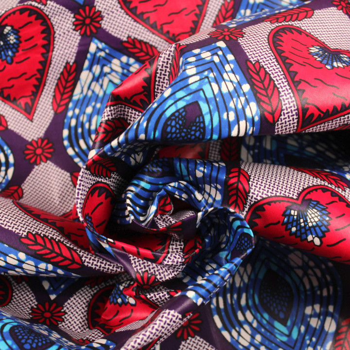 Tissu coton Wax imprimé géométrique rouge, bleu et rose