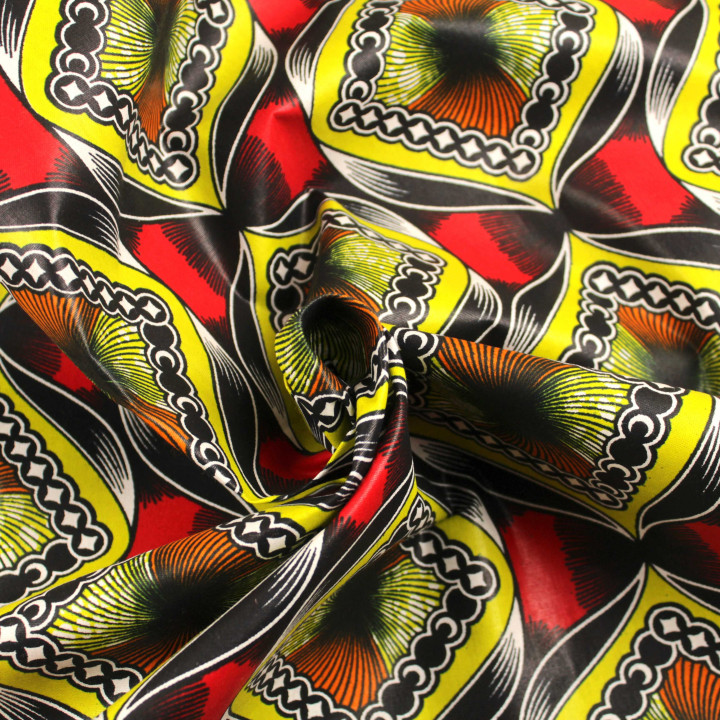 Tissu Wax africain géométrique multicolore jaune, noir, orange, rouge et blanc