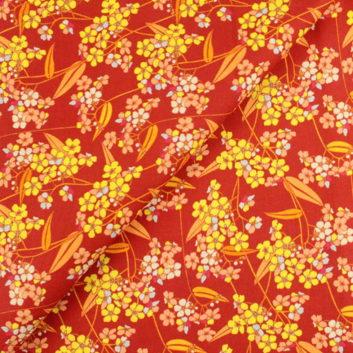 Tissu coton fleuri vintage orange, jaune, bleu et rouge motif floral rétro