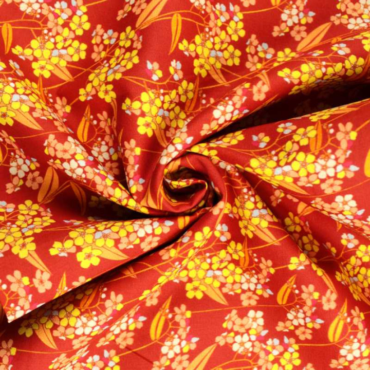 Tissu coton fleuri vintage orange, jaune, bleu et rouge motif floral rétro