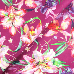 Coupon tissu fleuri fond noir aux motifs baroques orange et multicolore. Idéal pour la couture et la déco.