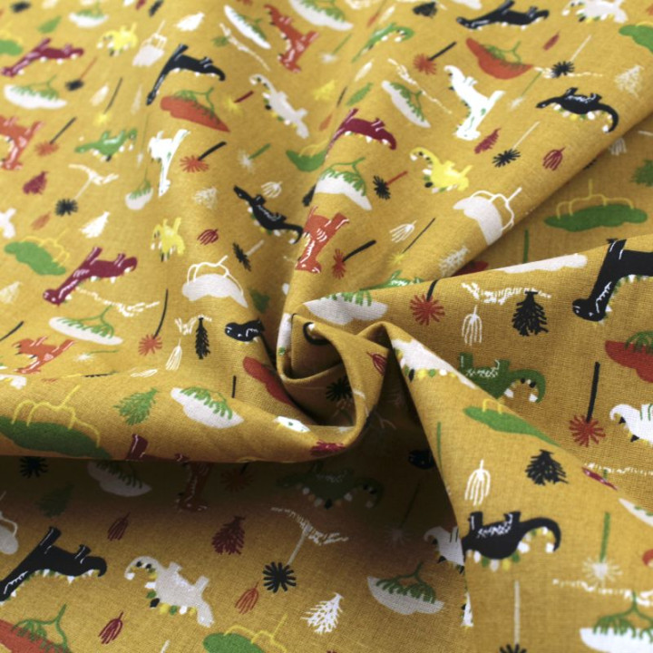Tissu en coton orange à motifs dinosaures multicolores - Idéal pour créations ludiques et colorées