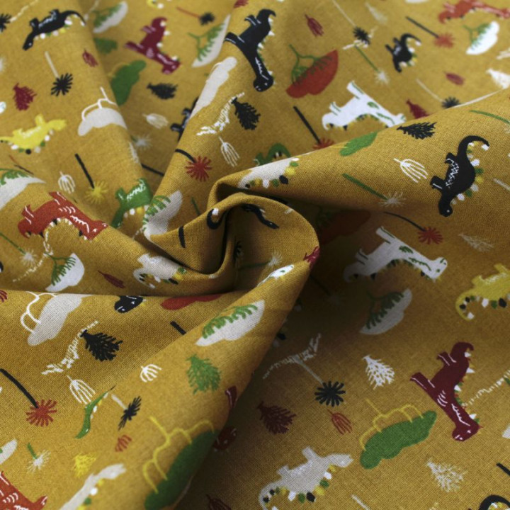 Tissu en coton orange à motifs dinosaures multicolores - Idéal pour créations ludiques et colorées
