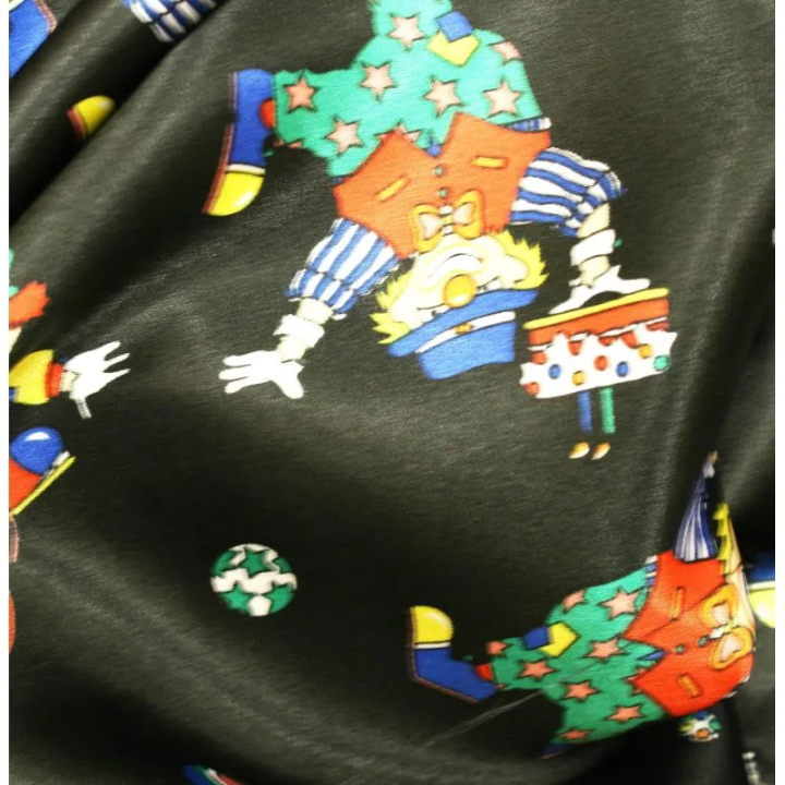 Tissu Satin polyester clowns sur fond noir