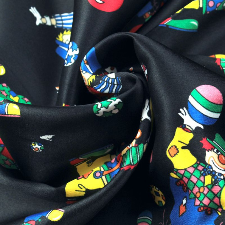Tissu Satin polyester clowns sur fond noir