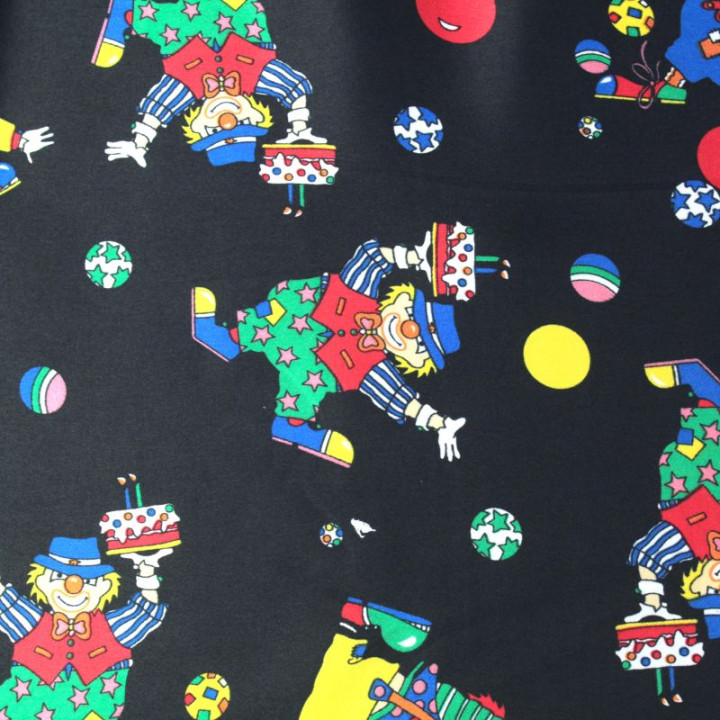 Tissu Satin polyester clowns sur fond noir