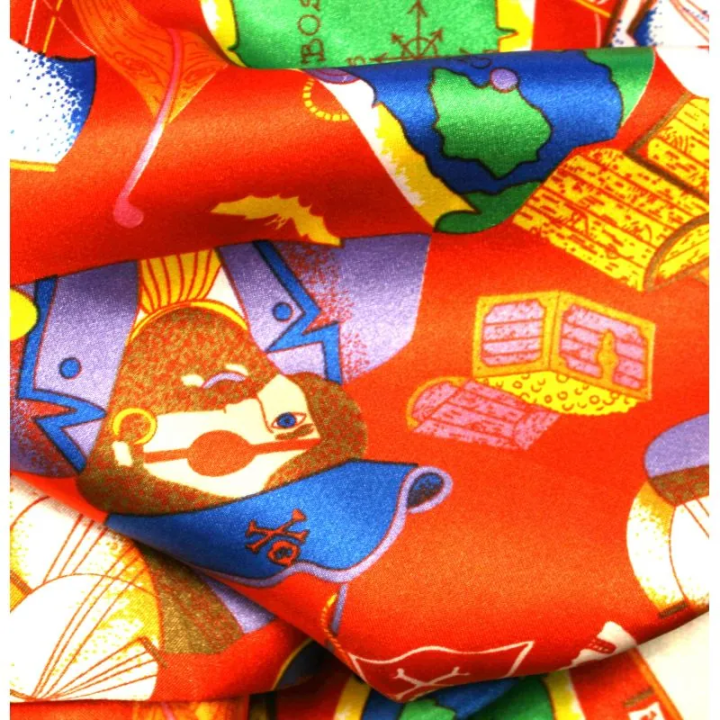 Tissu Satin polyester pirates sur fond rouge